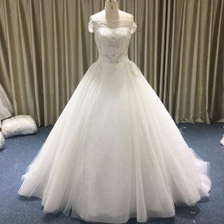 Elegant Ball Gown Wedding Dress with Off-the-Shoulder Neckline and Corset Back