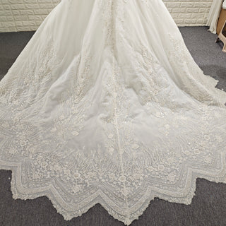 Wedding Dress with Shimmering Vertical Embroidery Meets Lace-Bordered Scalloped Train