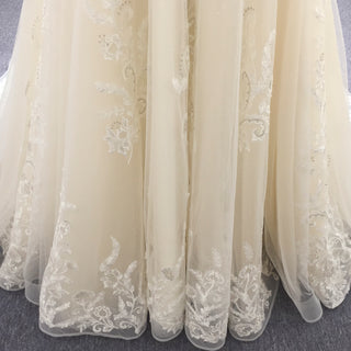 Robe de mariée élégante en dentelle à double décolleté plongeant et bustier transparent