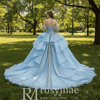 Off-Shoulder Gold Sequin Quinceanera Dress with Ruffled Peplum Oversized Back Bow