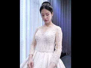 Luxury Beaded Blush Ball Gown Wedding Dress with Long Sleeves