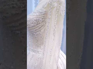 Luxury Beaded Blush Ball Gown Wedding Dress with Long Sleeves