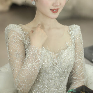 Sparkly Ball Gown Long Sleeve Wedding Dress with Long Bowknot